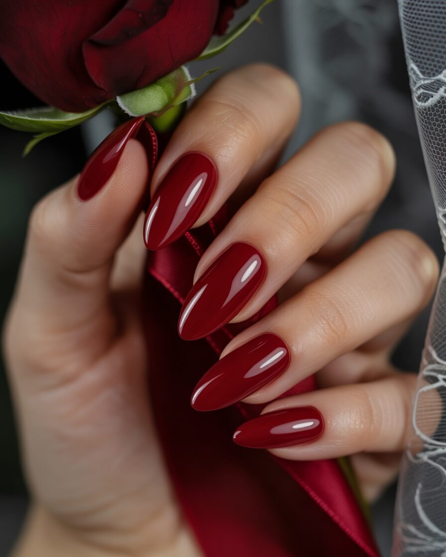 Glossy red nails for a bold bridal statement, adding drama and elegance to your wedding day.