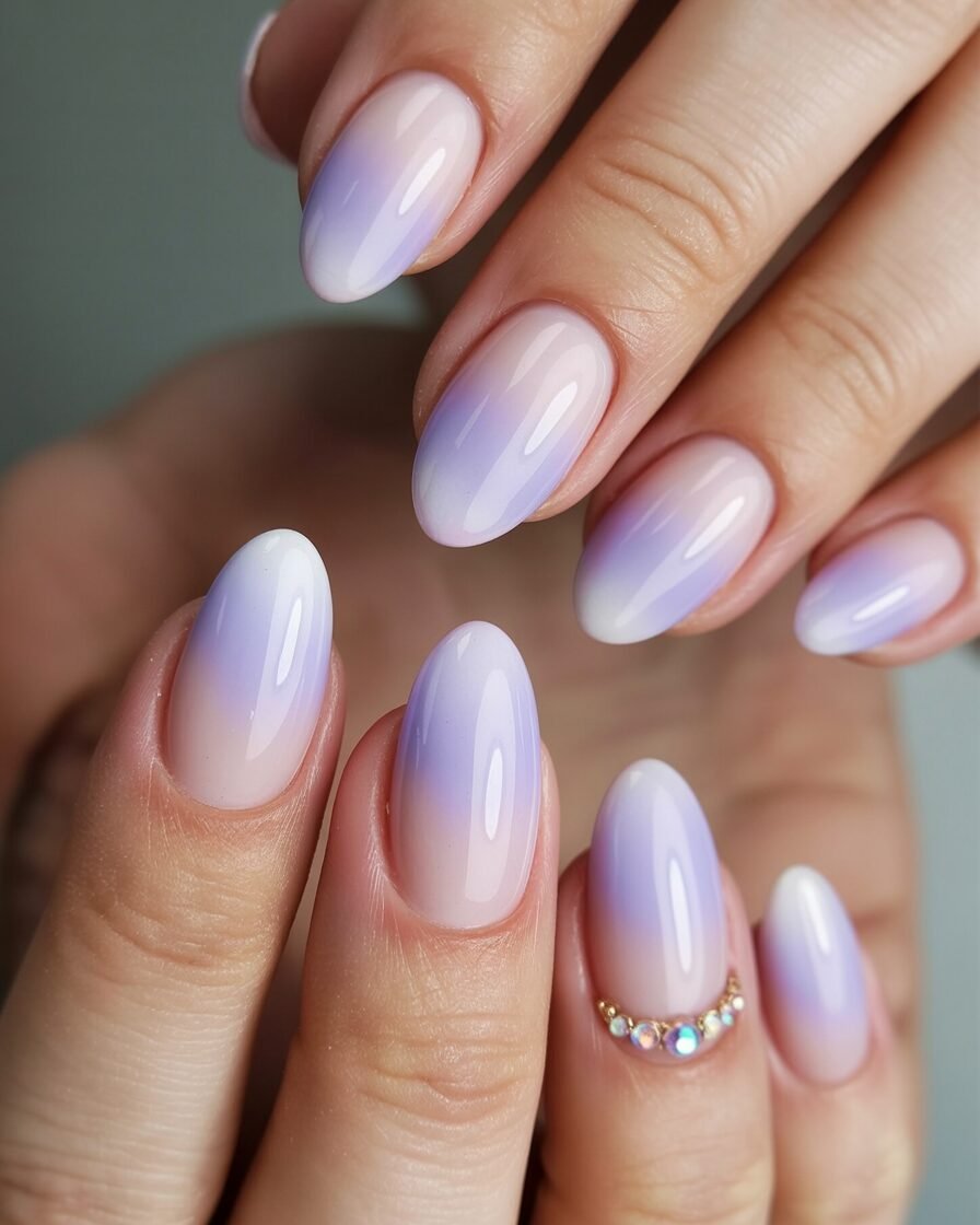 Soft pastel ombre gel nails in lavender, pink, and white.