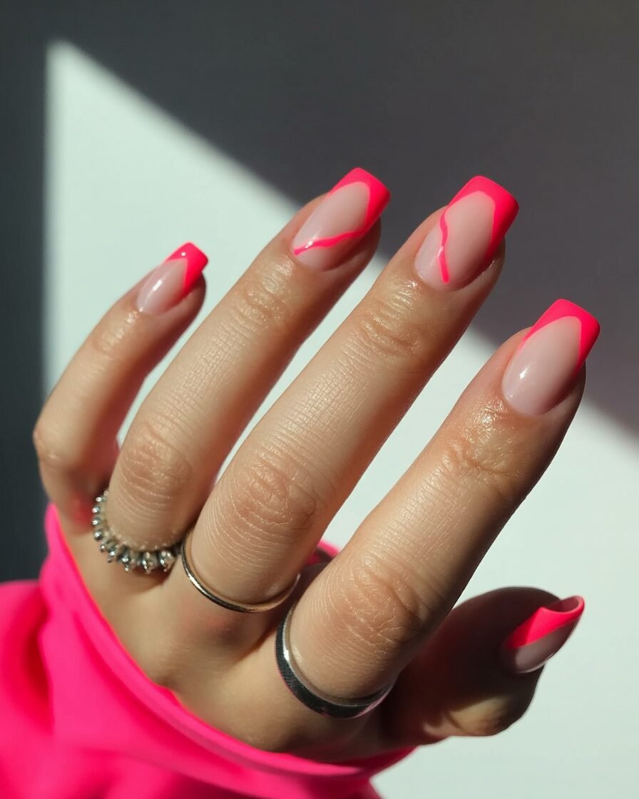 Neon pink accents on neutral nails