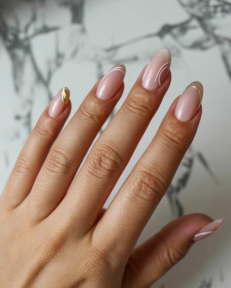 Pink-beige chrome nails above marble counter.