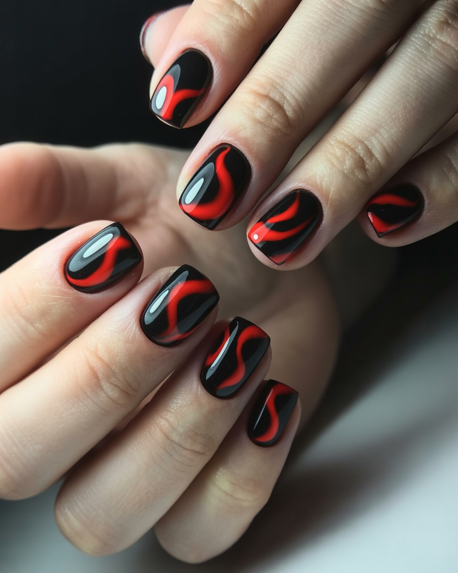  Glossy black nails with bold red swirl designs, creating a fiery and confident manicure for night events or special occasions.